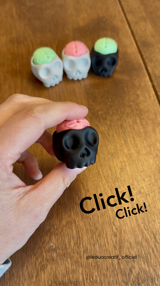 Porte clé clicker crâne fluo